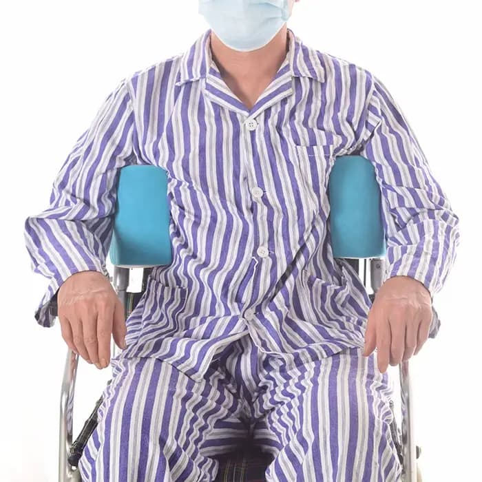 Coussin de position anti-latéral pour fauteuil roulant bloqué